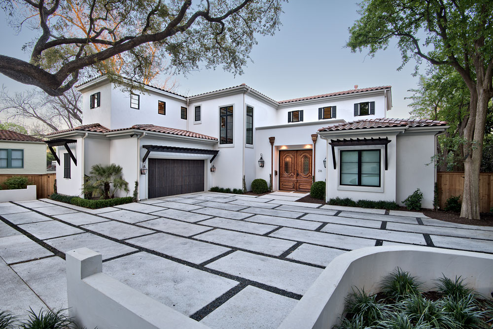 California Mediterranean residence with white stucco and arched openings